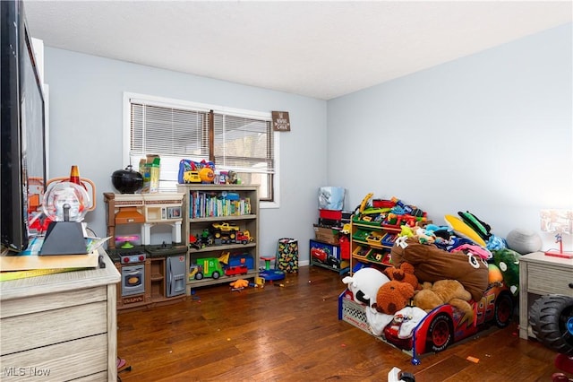 playroom with dark hardwood / wood-style flooring