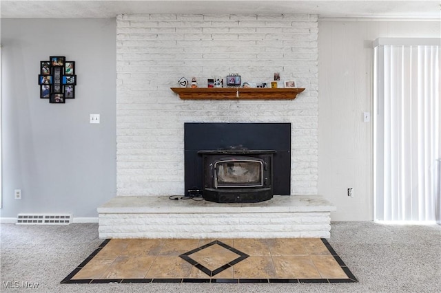 details with carpet floors and a wood stove