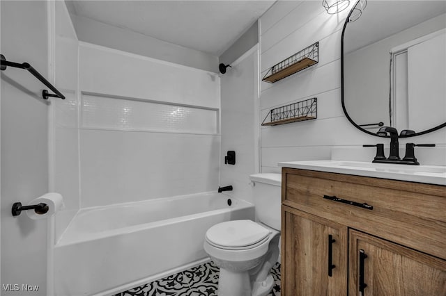 full bathroom featuring vanity, toilet, and washtub / shower combination