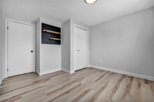 unfurnished bedroom with light hardwood / wood-style flooring