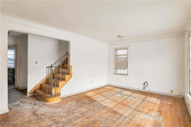 spare room with hardwood / wood-style flooring