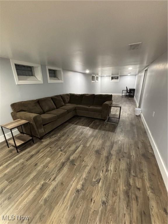 living room with dark hardwood / wood-style floors