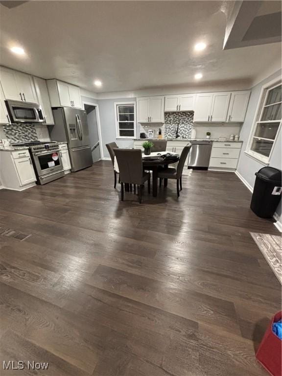 dining room featuring dark hardwood / wood-style flooring