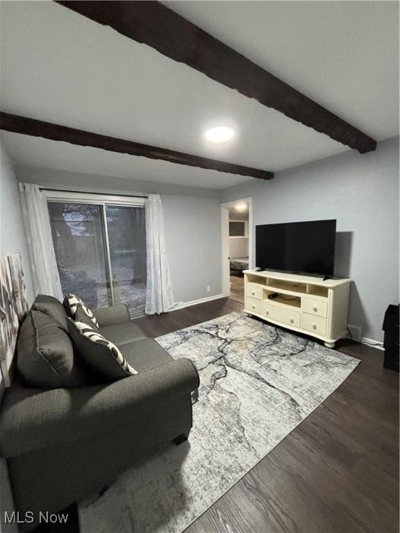 living room with beamed ceiling and dark hardwood / wood-style floors