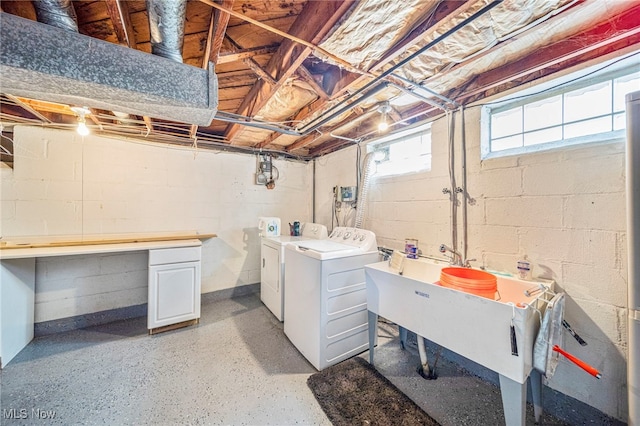 laundry area featuring sink and washing machine and dryer