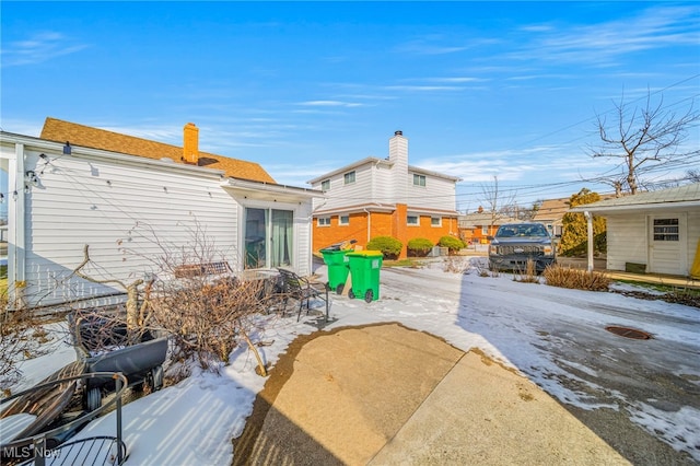 view of snow covered property