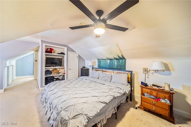 bedroom with vaulted ceiling, carpet, and ceiling fan