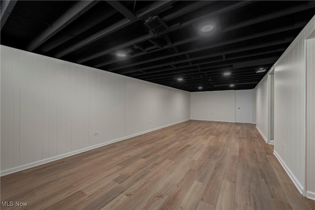 basement featuring light wood-type flooring