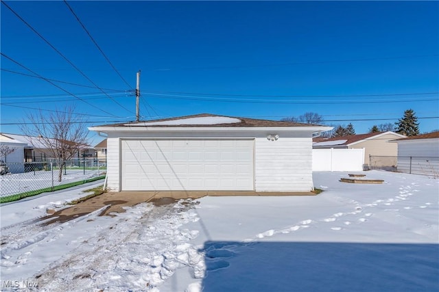 view of snow covered garage