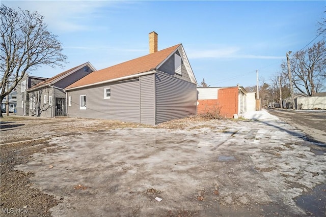 view of side of property with a garage