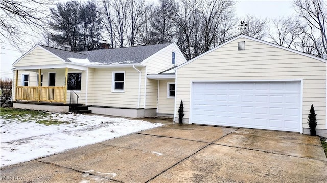 ranch-style house with a garage and covered porch