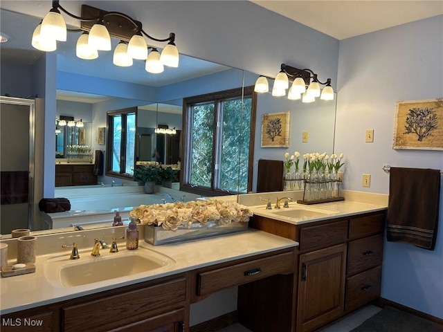 bathroom featuring double vanity, a shower stall, a sink, and a bath