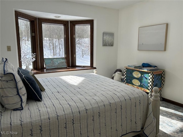 bedroom featuring baseboards