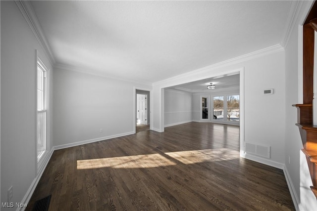 unfurnished living room featuring crown molding and dark hardwood / wood-style floors