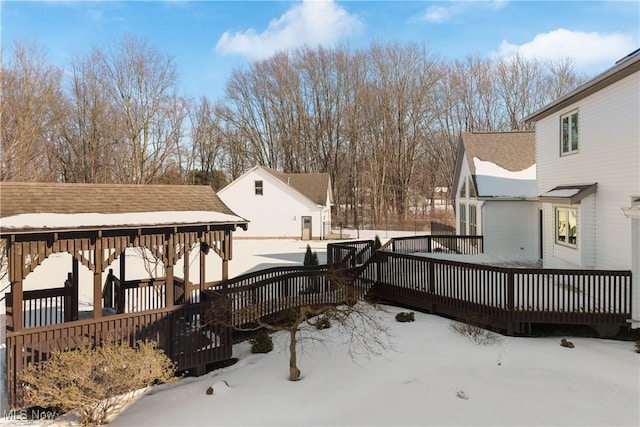 view of snow covered deck