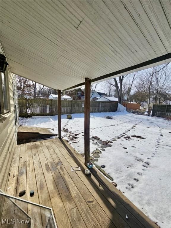 view of snow covered deck