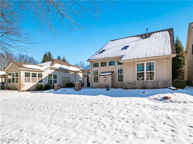 view of snow covered house