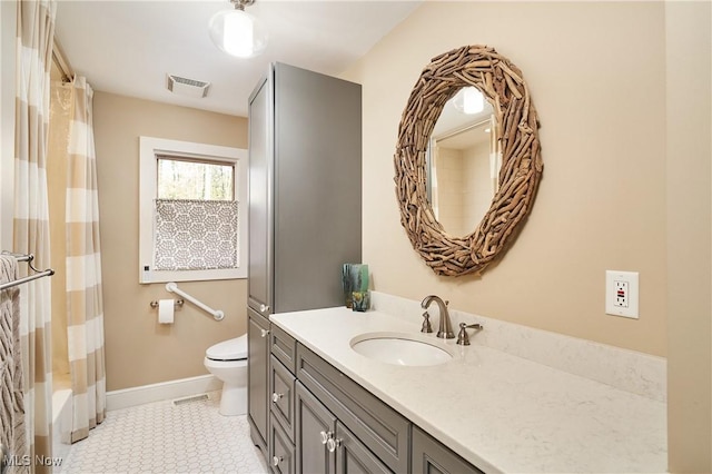 full bathroom featuring vanity, tile patterned floors, toilet, and shower / bath combo with shower curtain