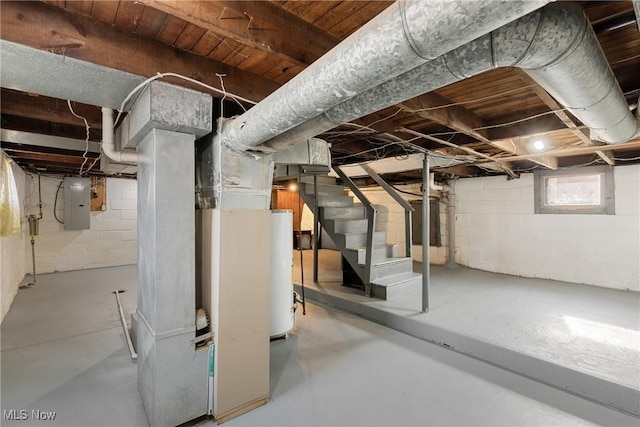 basement featuring heating unit, electric panel, and water heater