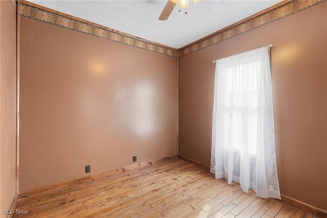 unfurnished room with ceiling fan and light hardwood / wood-style flooring