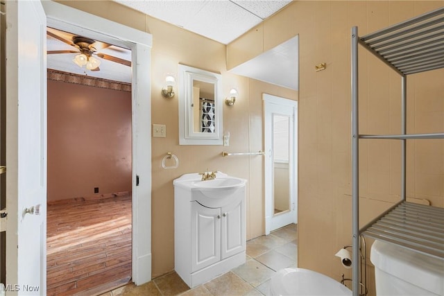 bathroom with ceiling fan, vanity, and toilet