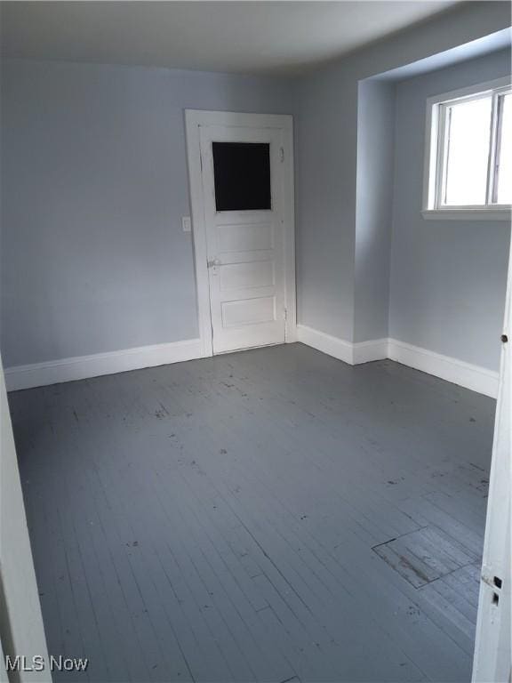 unfurnished room featuring wood-type flooring