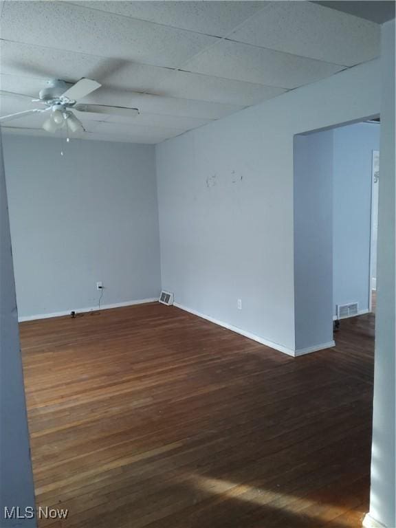 unfurnished room with ceiling fan and dark hardwood / wood-style floors