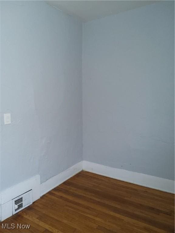 empty room with hardwood / wood-style floors