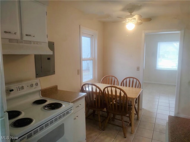 kitchen featuring light tile patterned floors, white electric stove, electric panel, ceiling fan, and white cabinets