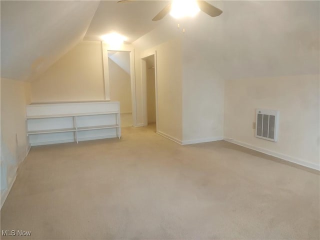 bonus room featuring ceiling fan, light colored carpet, and lofted ceiling