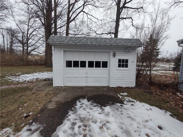 view of snow covered garage