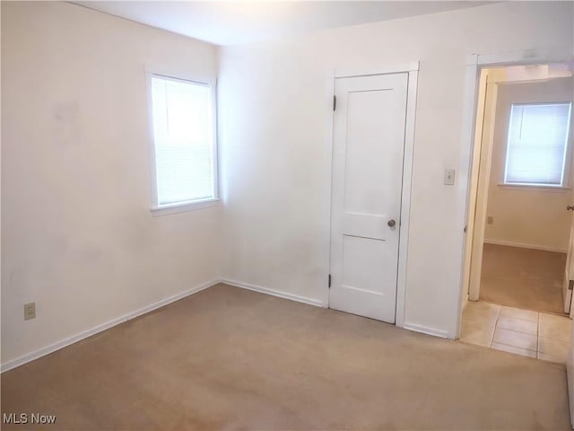 unfurnished bedroom with light tile patterned floors