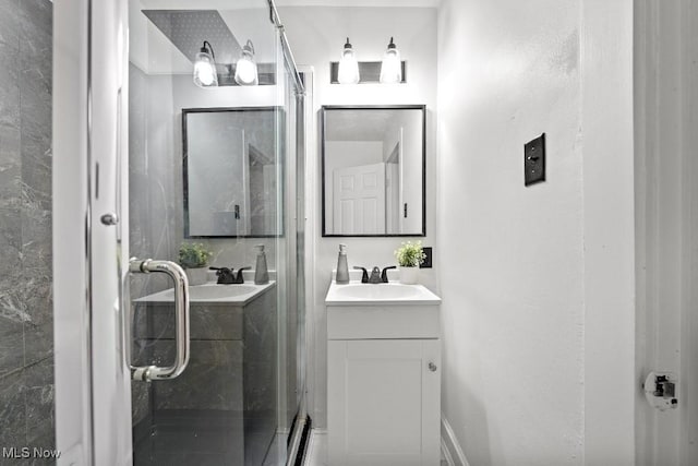 bathroom with vanity and an enclosed shower