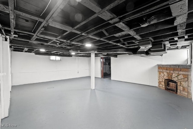 basement with a fireplace