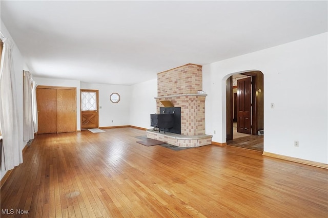 unfurnished living room featuring hardwood / wood-style flooring