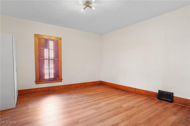 empty room with light wood-type flooring