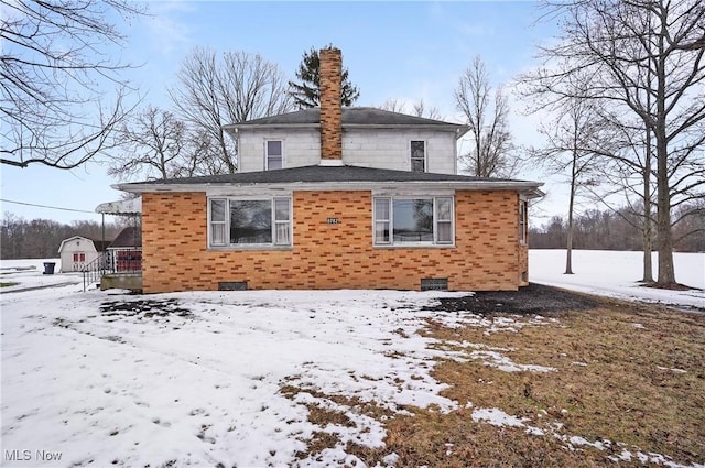 view of snow covered house