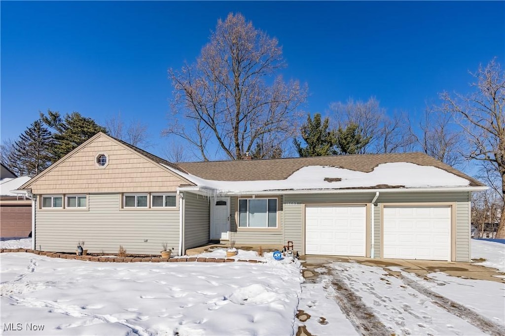 single story home featuring a garage