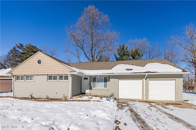 single story home featuring a garage