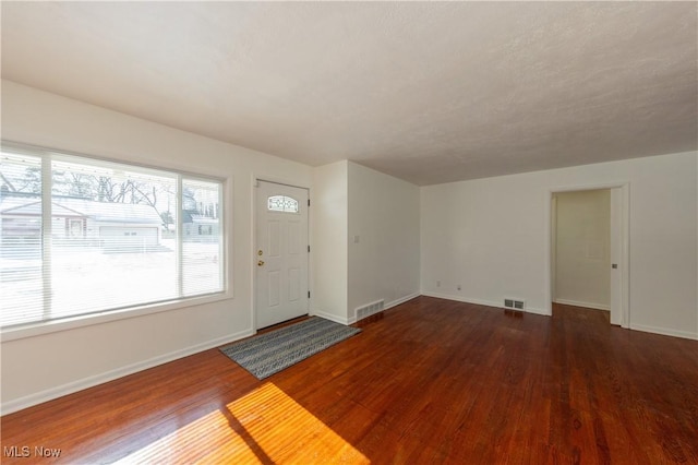 entrance foyer with dark hardwood / wood-style floors