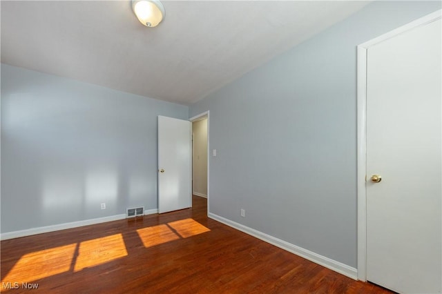 unfurnished room featuring hardwood / wood-style floors