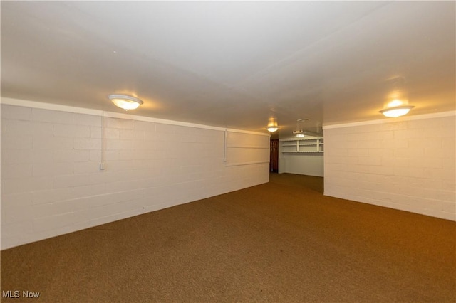 basement with dark colored carpet