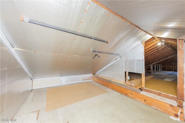 bathroom featuring vaulted ceiling