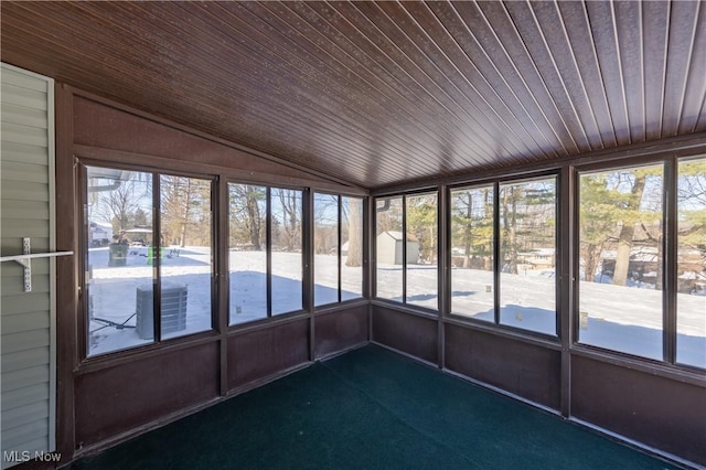 unfurnished sunroom with vaulted ceiling and wood ceiling