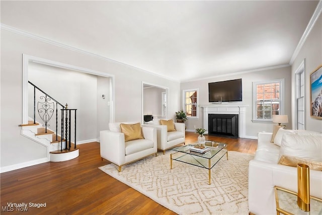 living room featuring wood-type flooring and crown molding