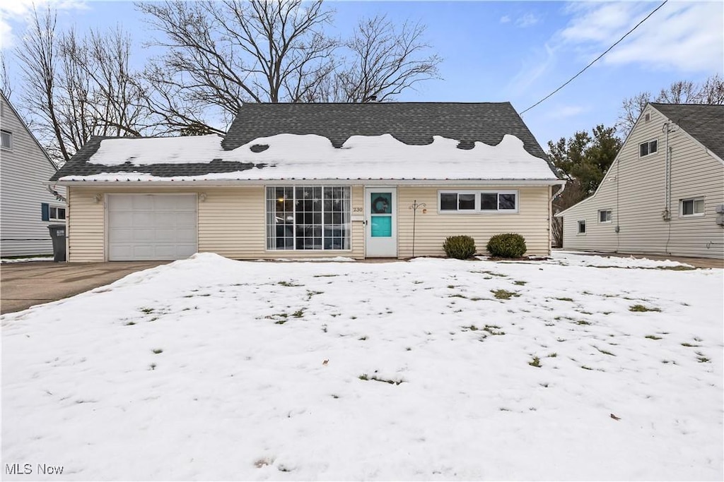 view of front of property with a garage