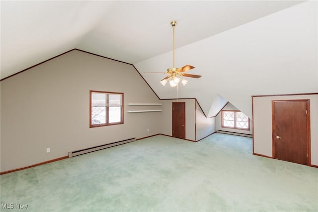 bonus room with ceiling fan, light colored carpet, lofted ceiling, and a baseboard heating unit