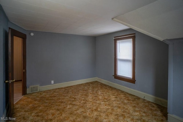 bonus room with carpet flooring