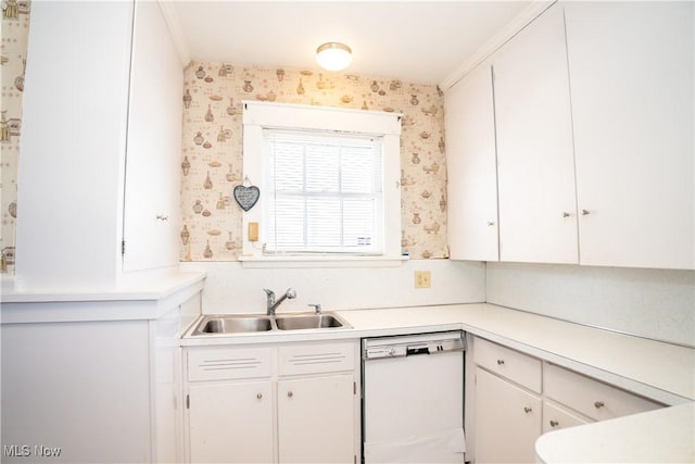 kitchen with dishwasher, sink, and white cabinets