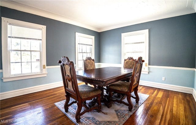 dining area featuring crown molding and dark hardwood / wood-style flooring